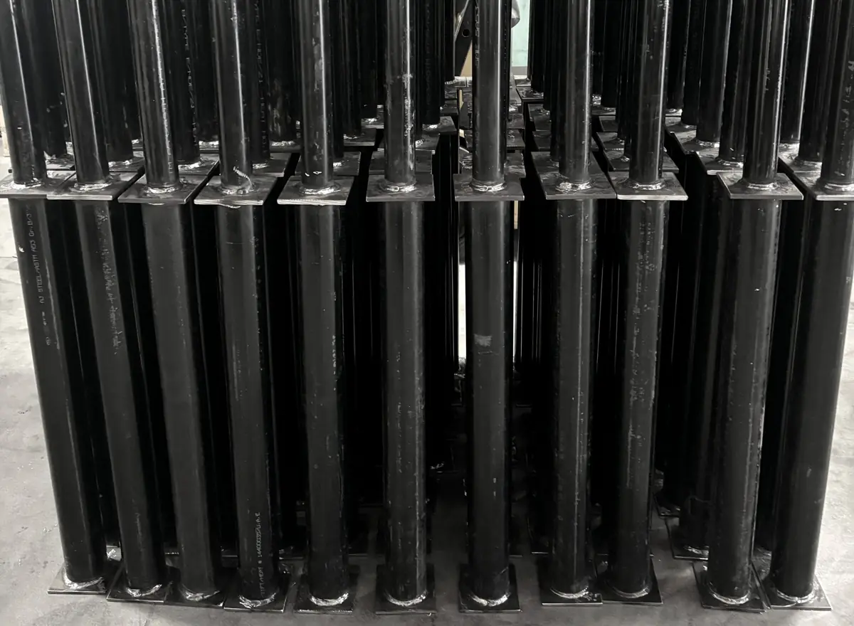 Wall of welded carbon steel post assemblies from a 130-piece run