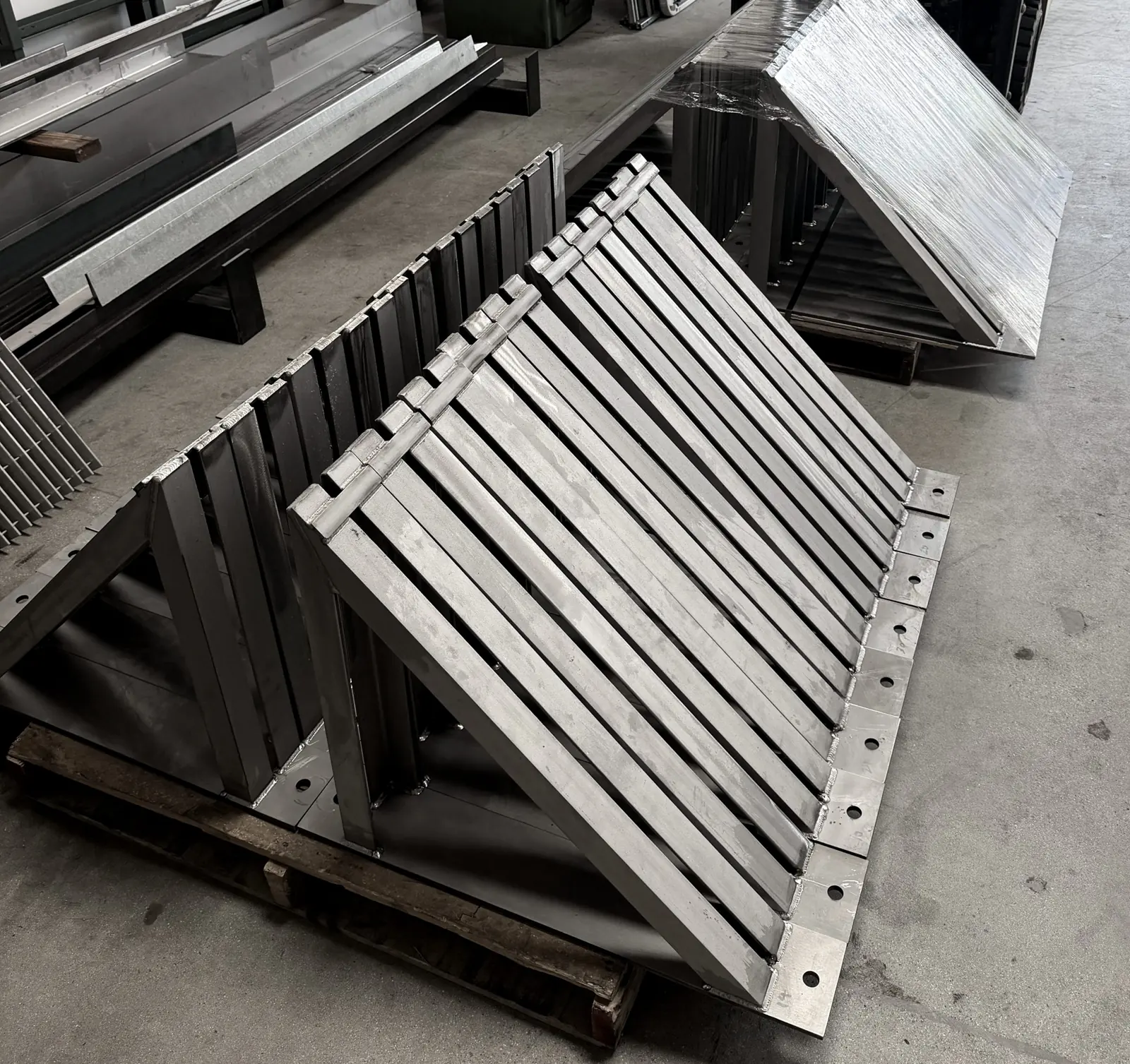 Welded rack assemblies from a production run
