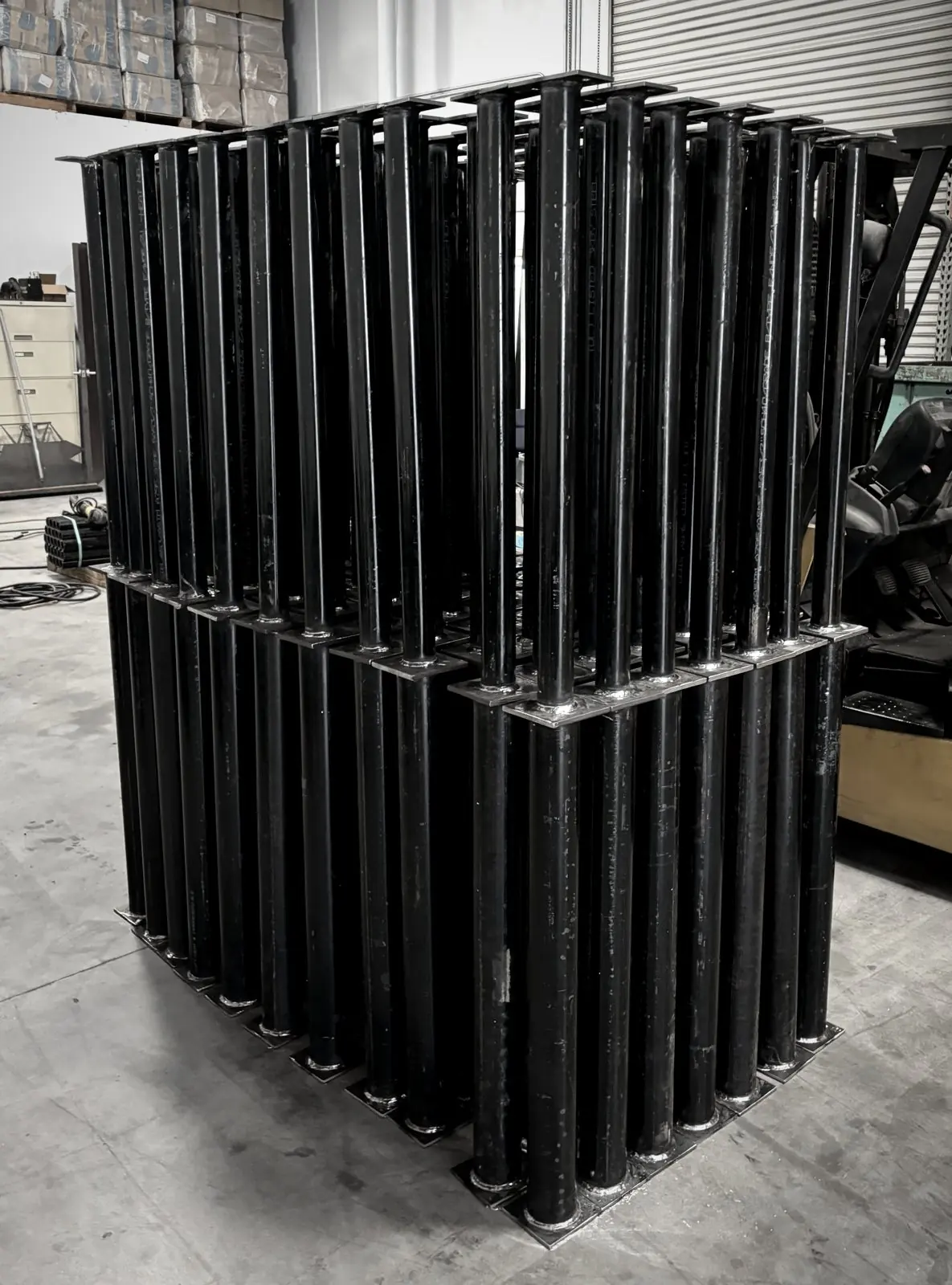 130 carbon steel post assemblies stacked in the shop