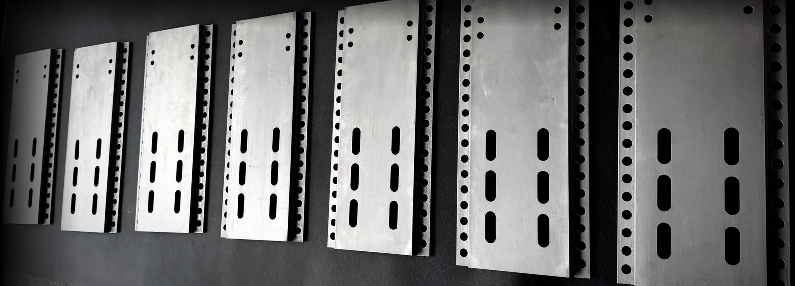 Seven identical plate assemblies from a 13-piece run